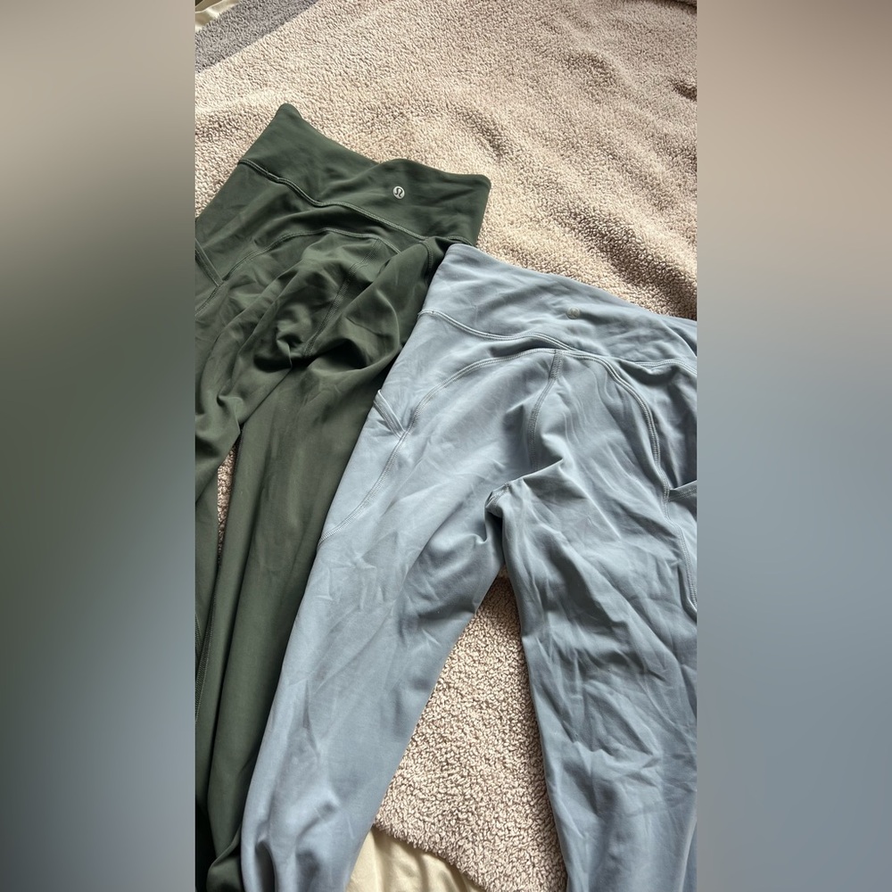 two pair of lululemon workout legging with pockets